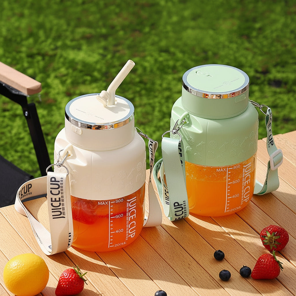 Two juice cups with straws on a wooden surface outdoors
